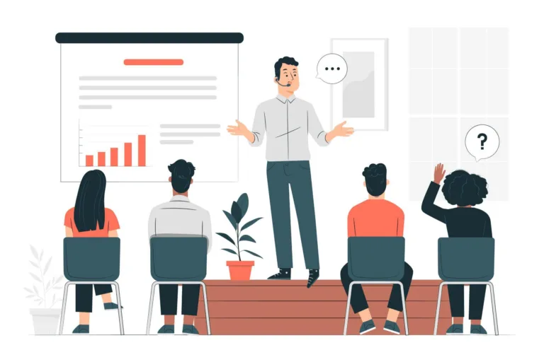 A man standing in the office explaining something in front of people