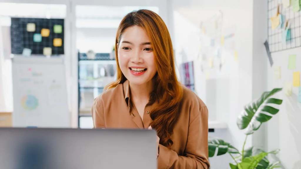 asia-businesswoman-social-distancing-new-normal-situation-virus-prevention-while-using-laptop-presentation-colleagues-about-plan-video-call-while-work-office (1)