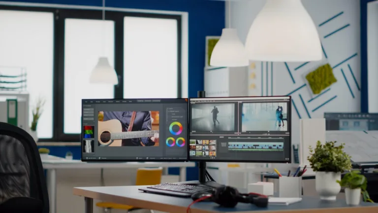 empty-modern-creative-agency-office-with-dual-monitors-setup-with-processing-video-film-montage-vide