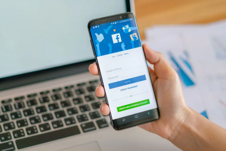 a-man-holding-a-phone-with-facebook-app