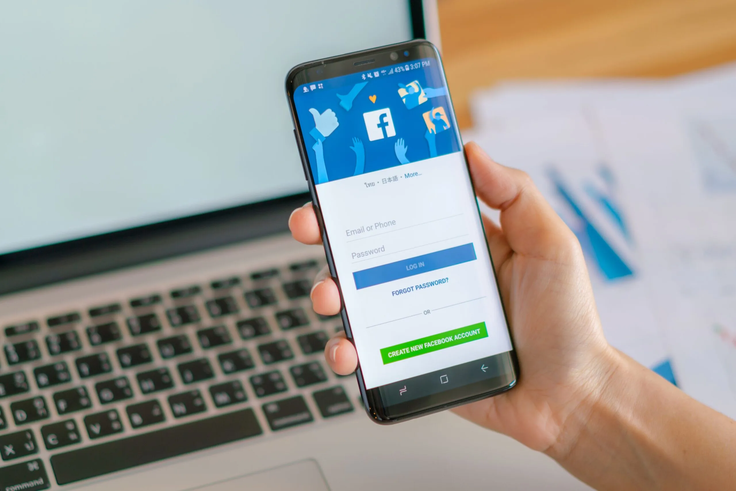 a-man-holding-a-phone-with-facebook-app
