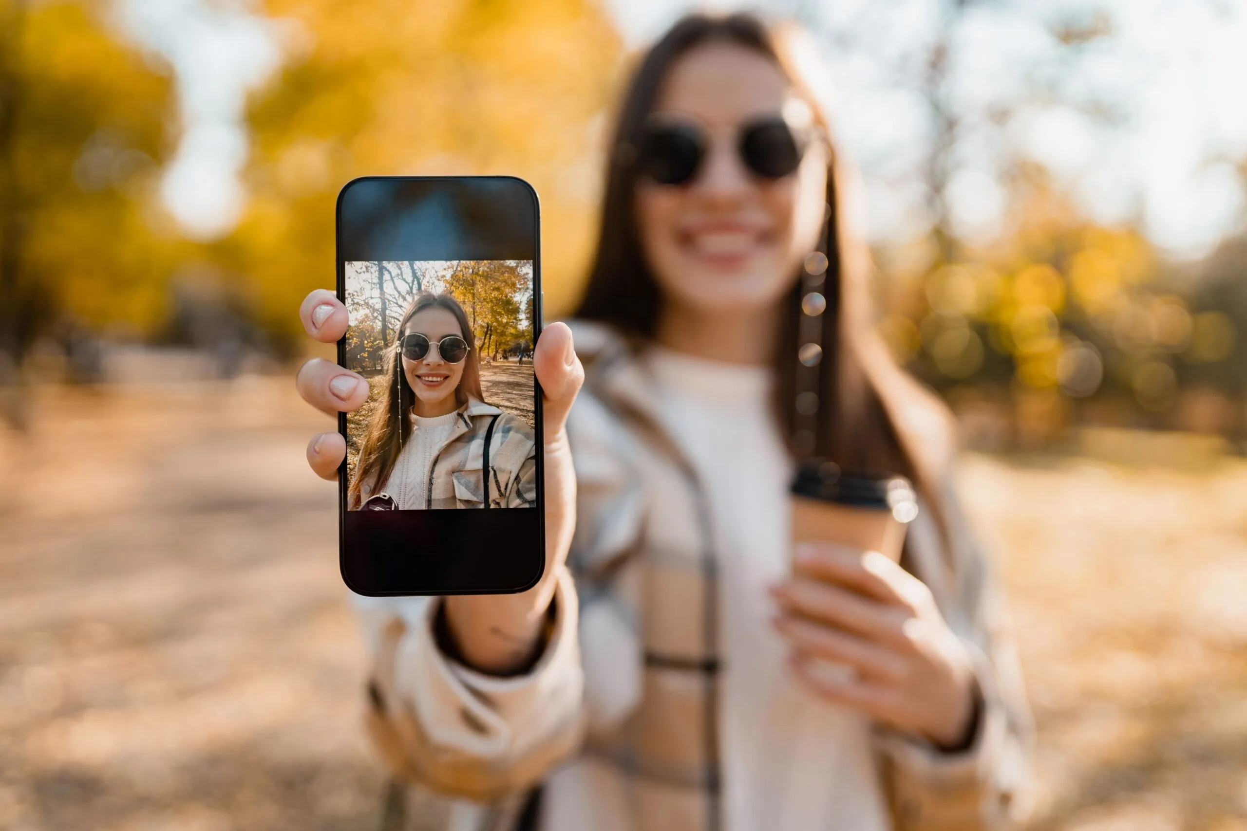 attractive-young-woman-walking-autumn-wearing-jacket-using-phone