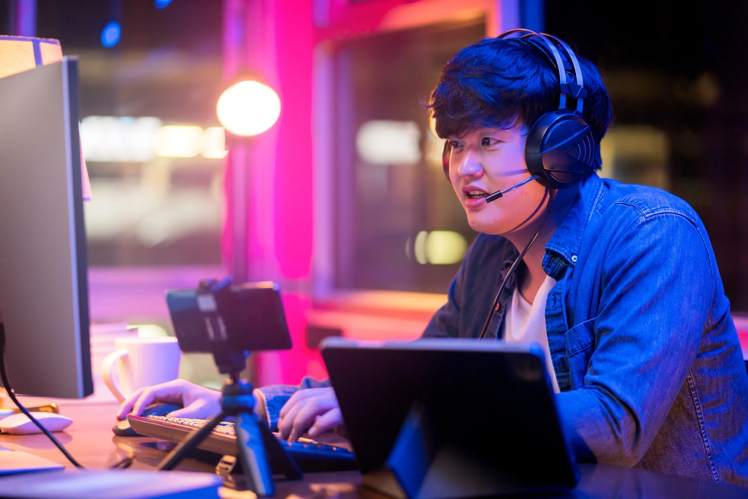 esport-online-game-streaming-asian-male-wear-headset-play-dogital-metaverse-cyber-space-online-match