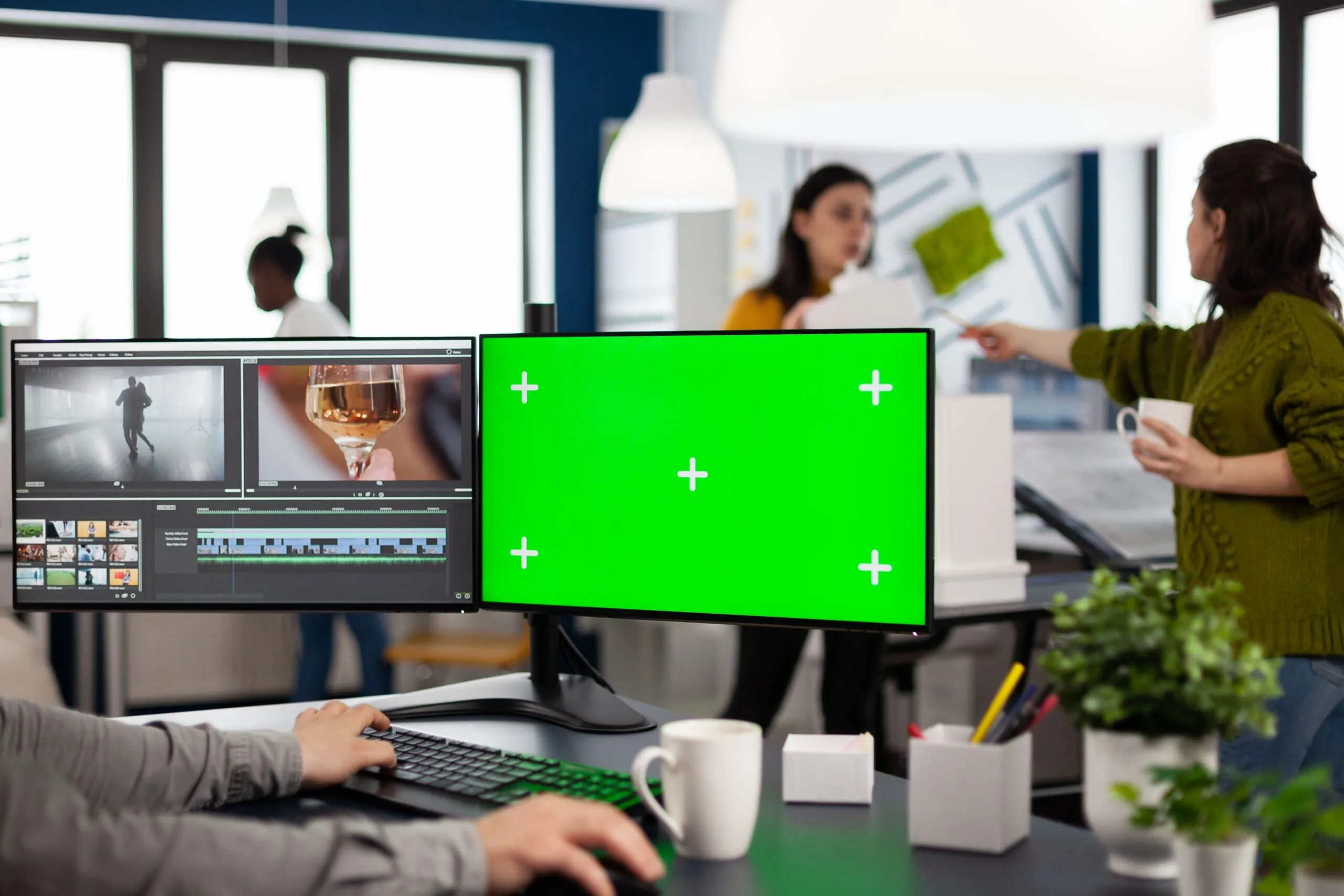 Video-maker-editing-movie-using-post-production-software-working-creative-agency-pc-with-green-screen-chroma-key-mock-up-isolated-display