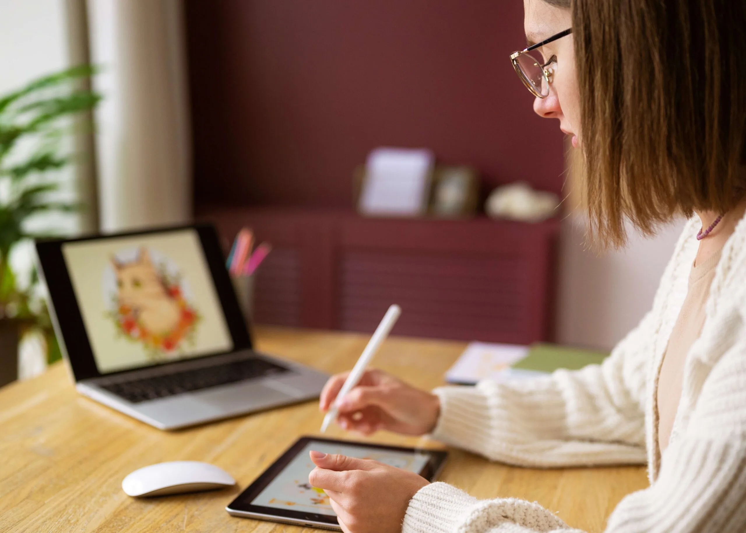 adult-female-illustrator-working-tablet-device