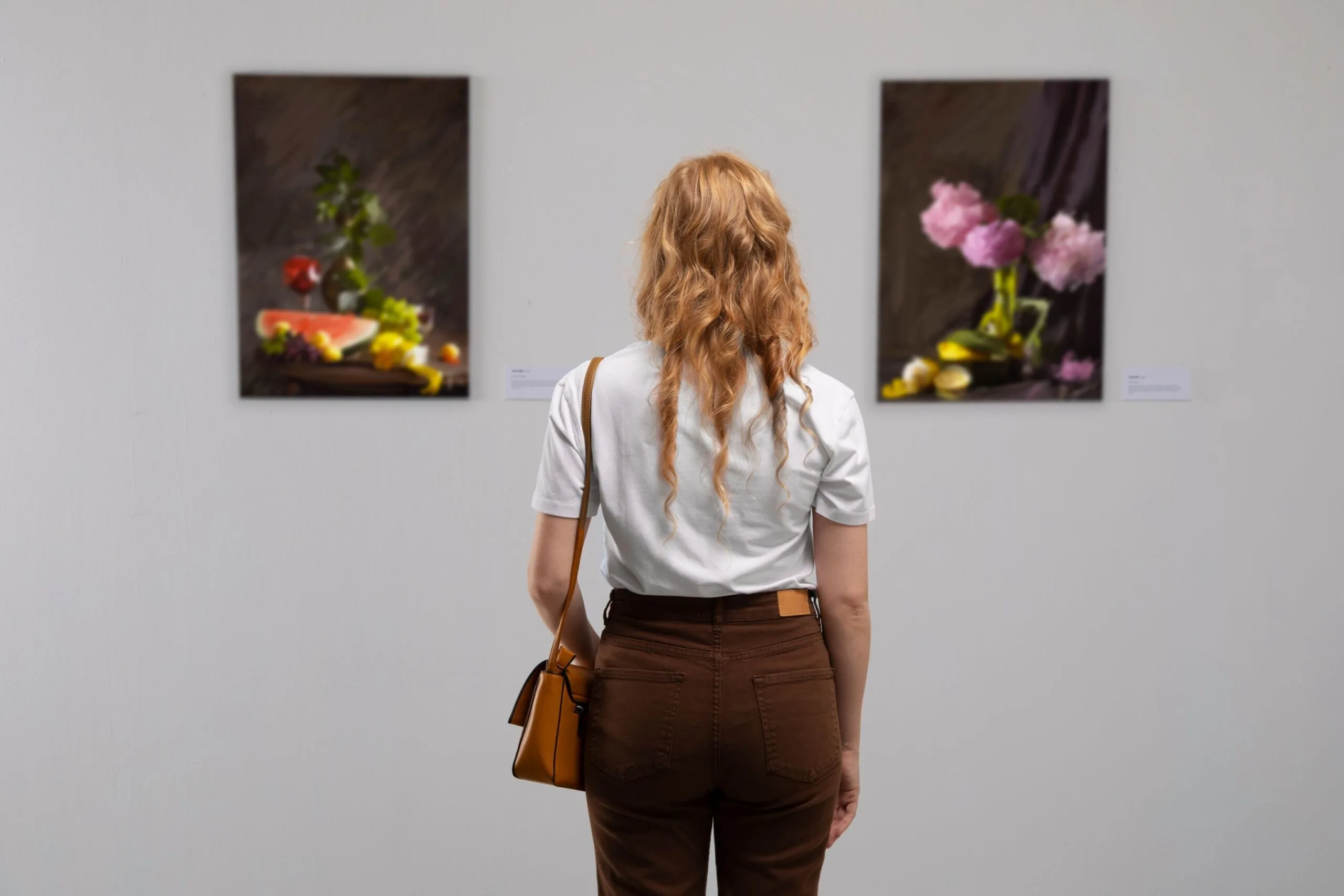 back-view-woman-looking-painting