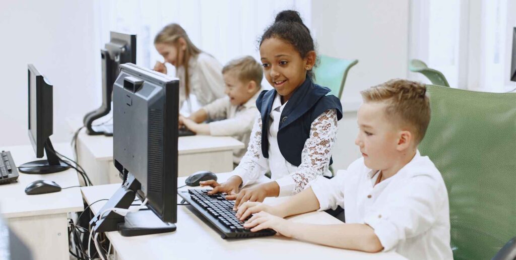 children playing around with AI virtual human program on computer