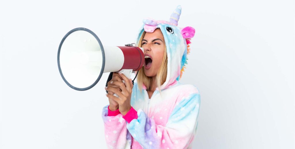 woman in unicorn outfit with megaphone