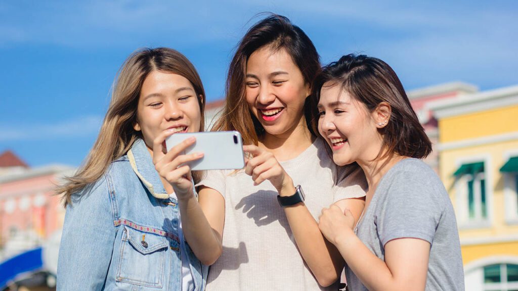 girls looking at their mobile