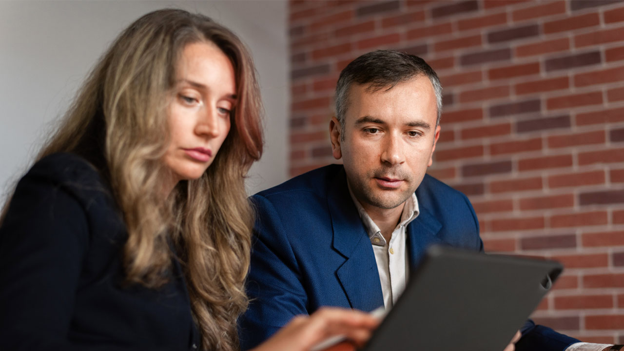 woman and man giving presentation