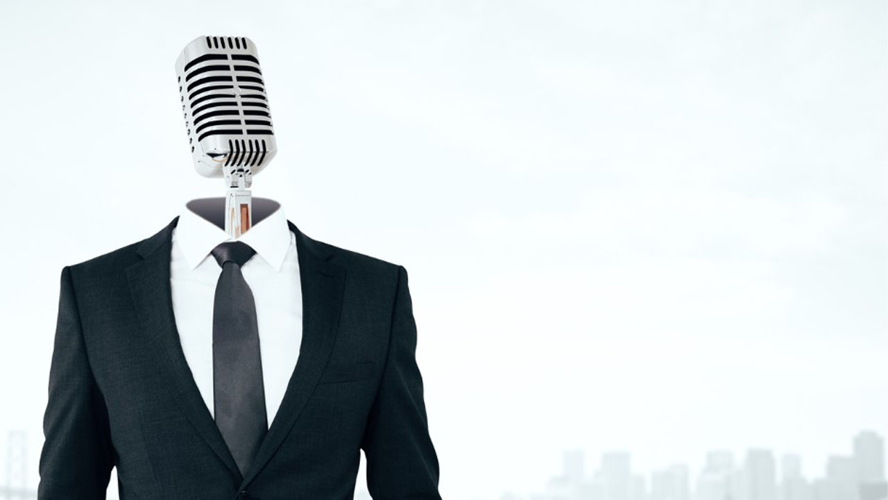 man in a suit with a mic for a head