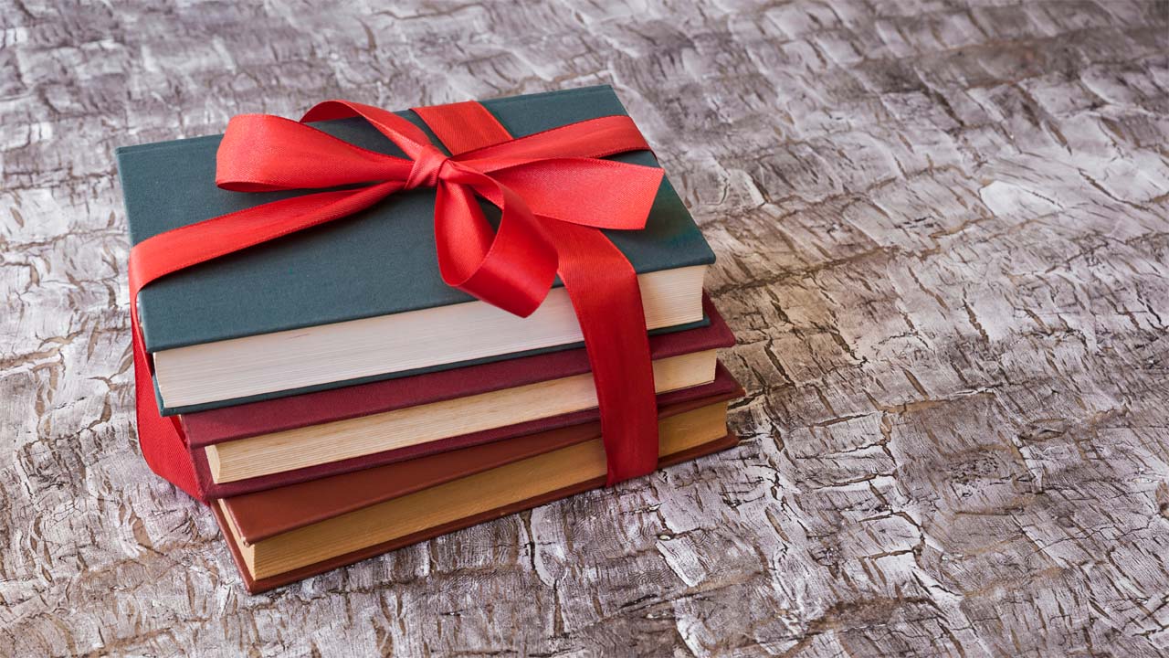 books tied with a red bow