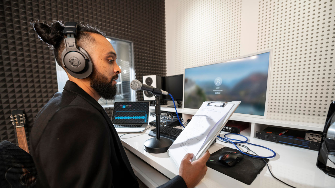 man listening to his manuscript using a voice cloning service