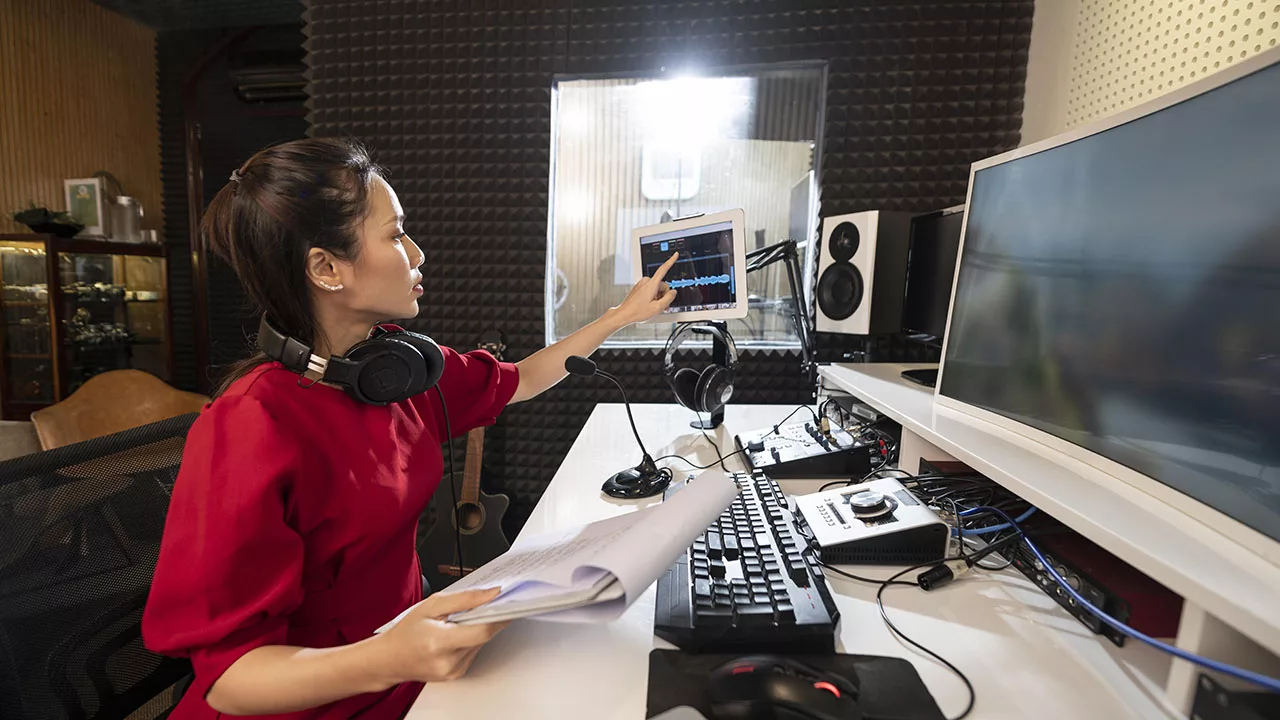 a woman using professional radio equipment
