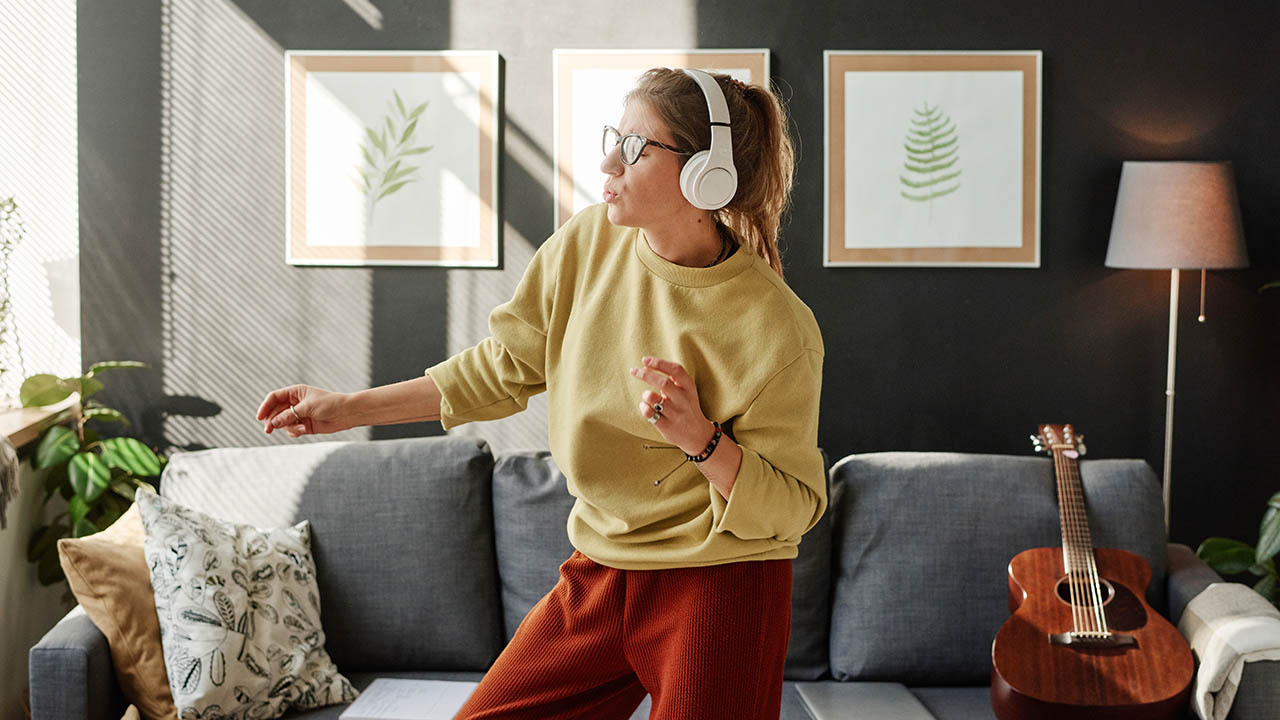 a woman enjoying music using her wireless headphones