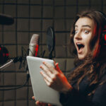 a girl doing voice over work for a project