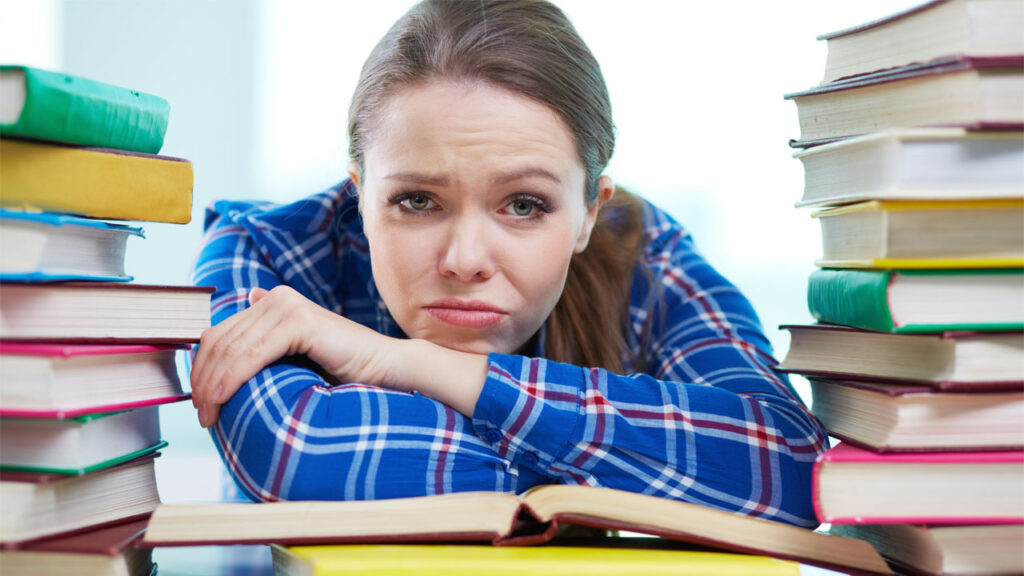 a frustrated student having issues reading her books