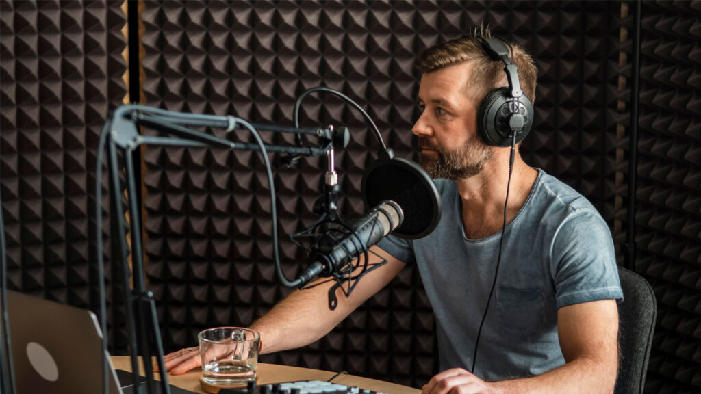 a man recording his voice in a studio