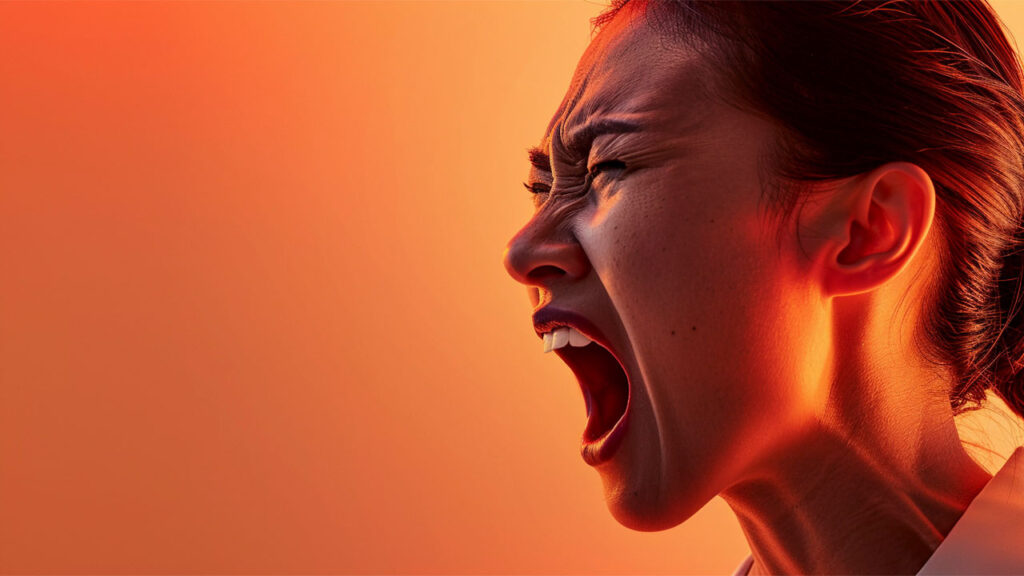 a woman shouting and showing strong emotion