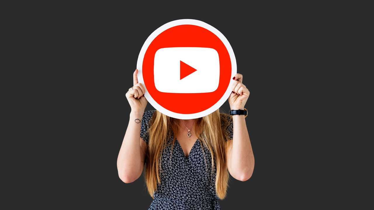 woman holding a youtube icon