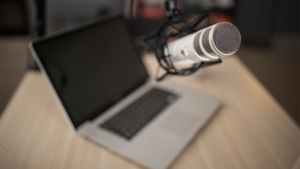 high angle of radio microphone and laptop running a voice changer tool