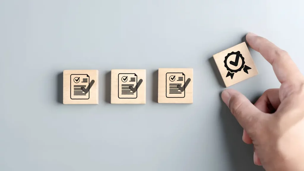 a person placing wood blocks that represent ethics