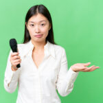 female voice actor shrugging