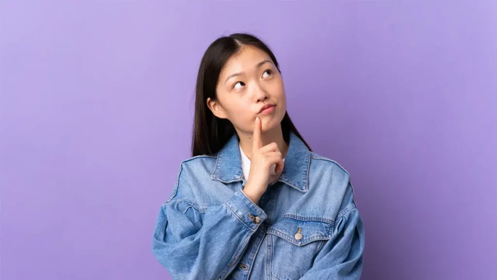 a young woman thinking