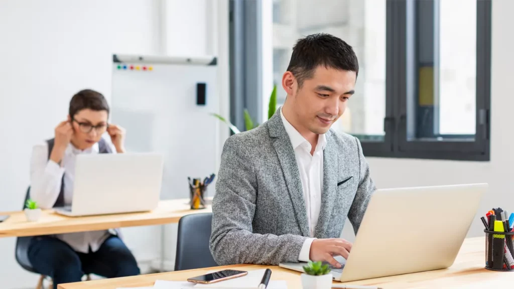 man on computer at desk