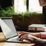 woman typing on computer