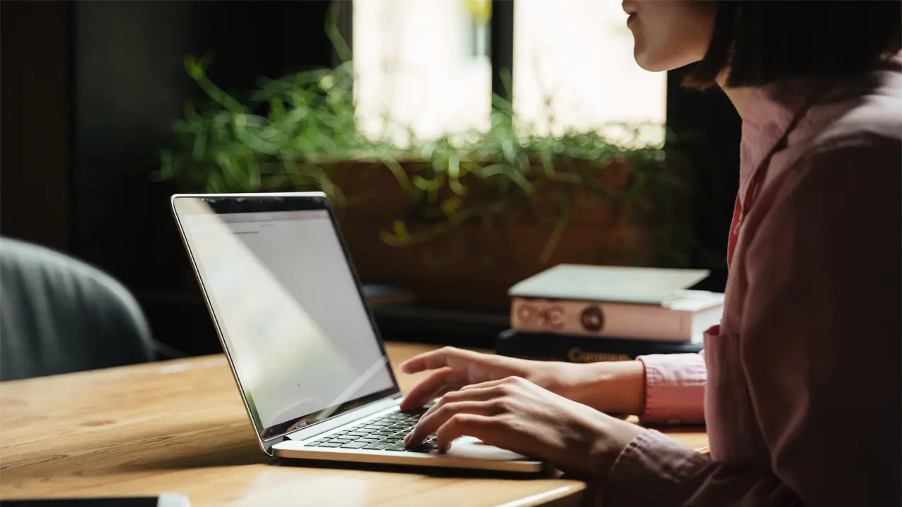 woman typing on computer