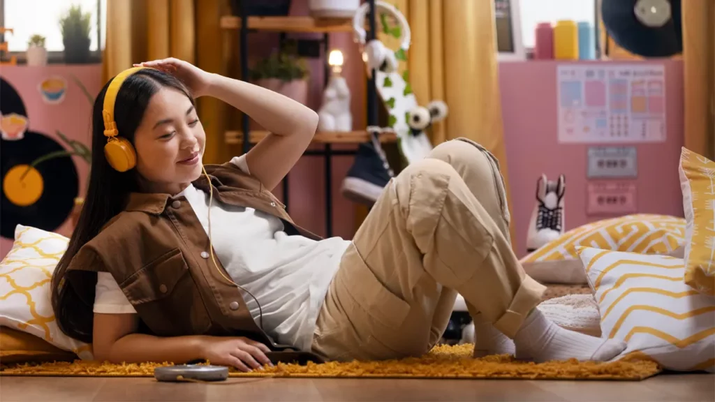girl laying on floor with headphones