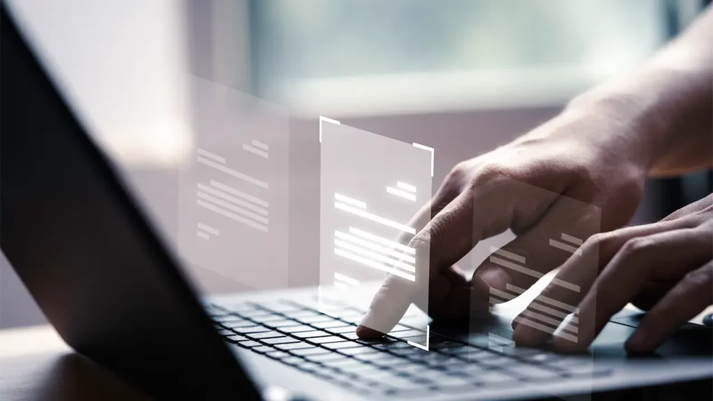 hands typing on a keyboard with sci-fi screens popping up