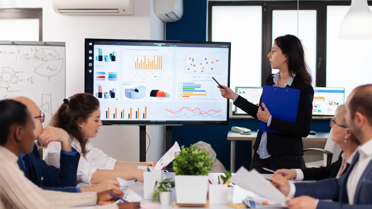 woman presenting in front of company