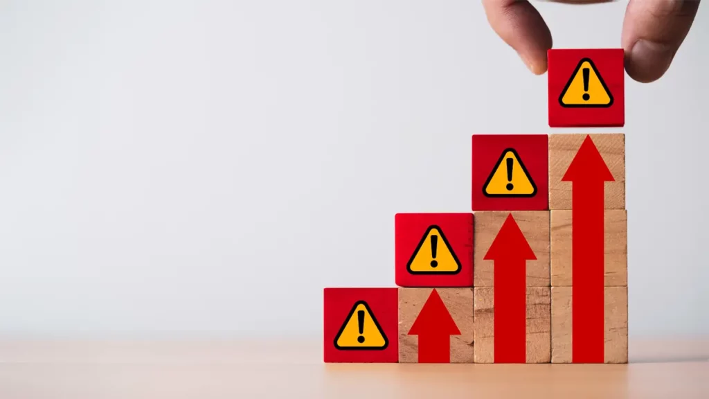 Cubes representing increasing risk being stacked on top of each other.
