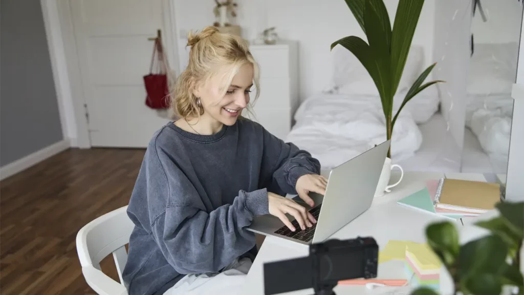 A woman working on her laptop.