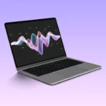 A laptop with an audio waveform shape on its' screen.