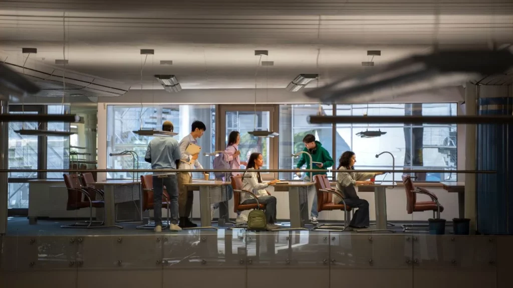 Group of people collaborating in a modern office setting.