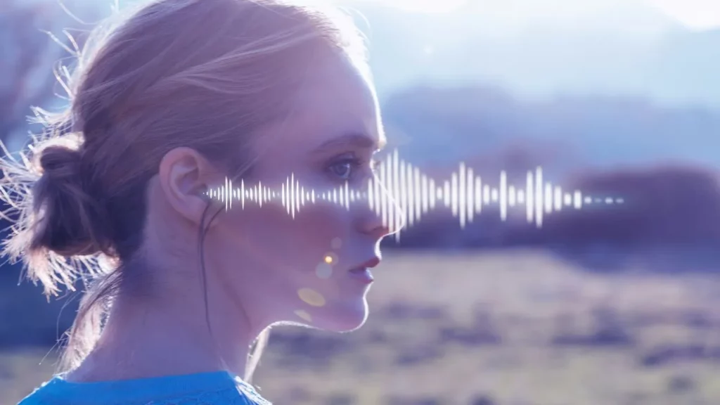 Digital artwork of a woman’s profile with audio waveform overlay against a serene landscape.