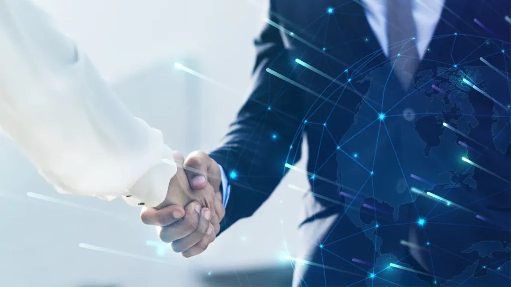 Two business people shaking hands.