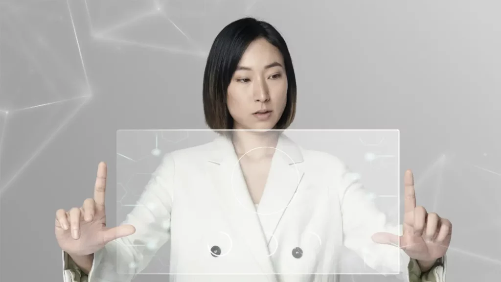 A business woman using holographic technology.