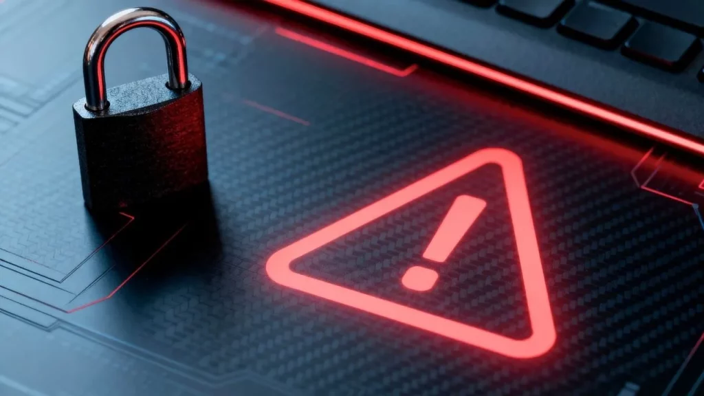 A close-up digital illustration of a metallic padlock chained to a glowing red exclamation mark warning symbol on a dark, circuit-board-patterned background, symbolizing security risk or alert.