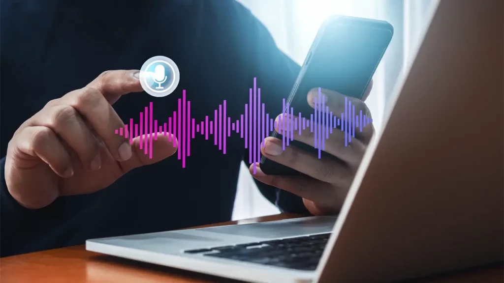 A person accessing audio files on their laptop.