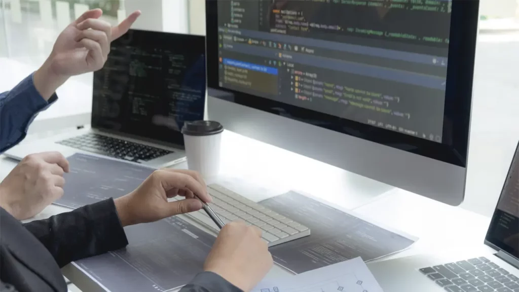 Two programmers discussing code.