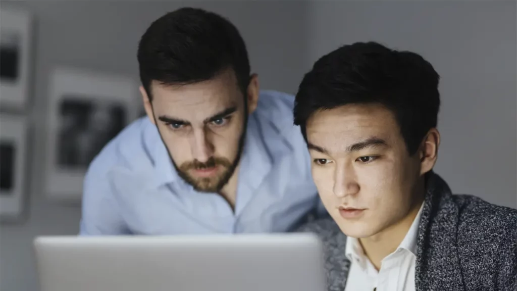 Two developers thinking about a solution.