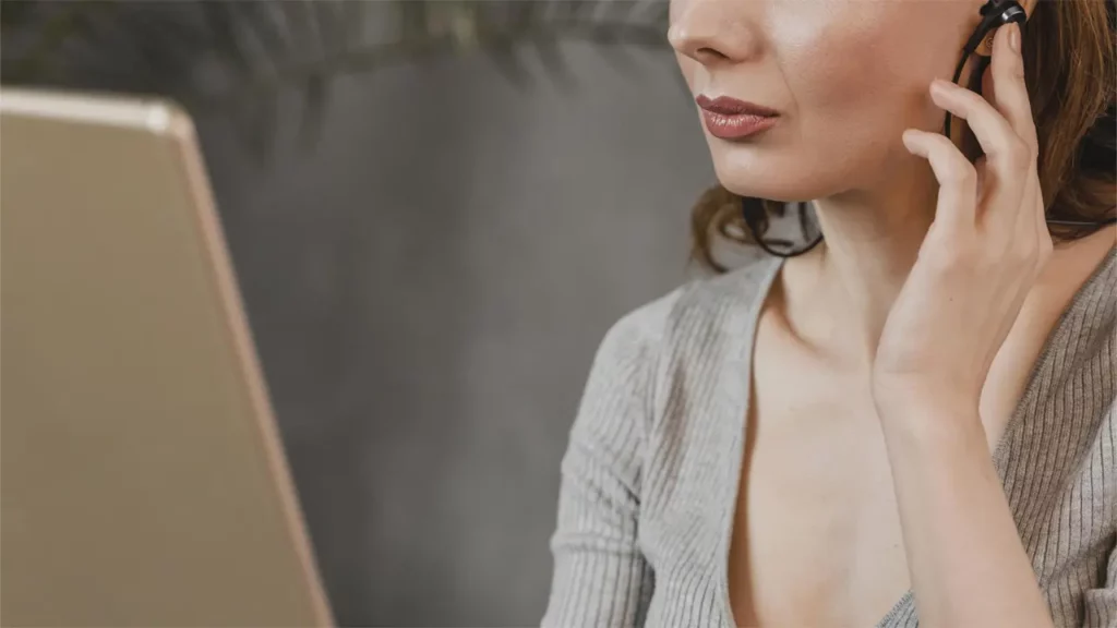 A women listening to something on her laptop.