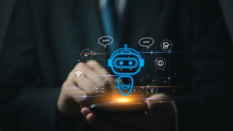 A close-up of a person in a suit holding a smartphone with a glowing blue AI chatbot icon and various digital service icons floating above it.