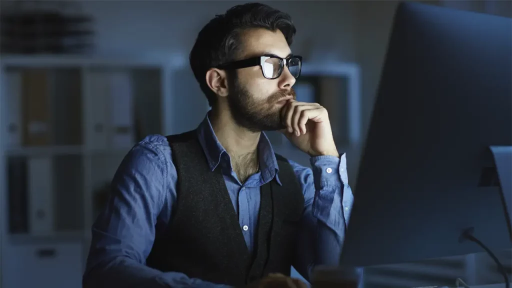 A male developer thinking.