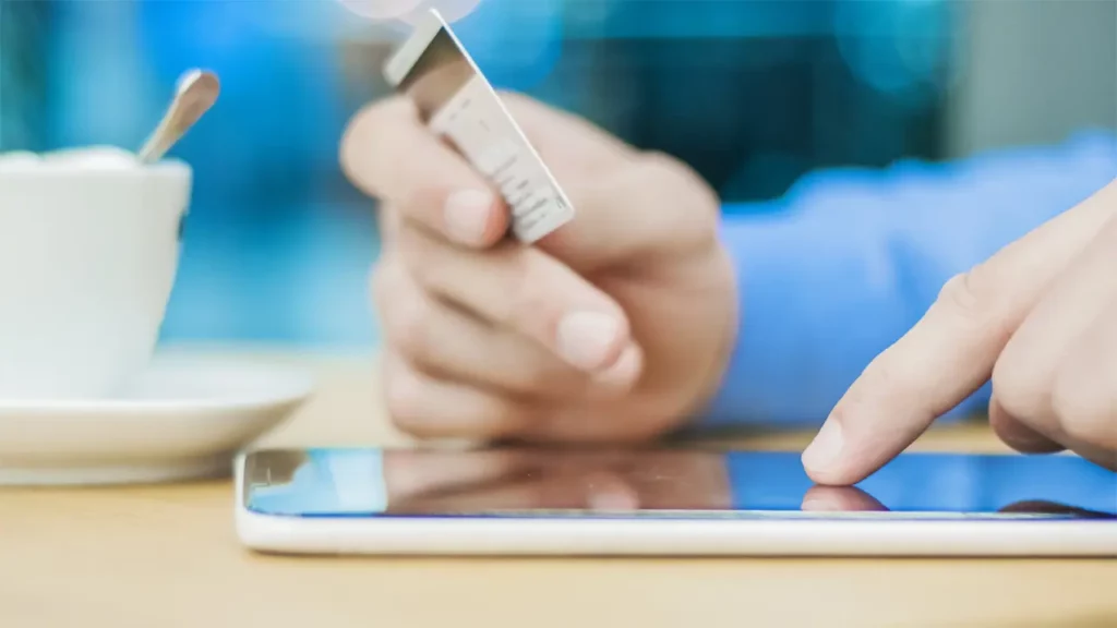 A person making a card payment on their phone.