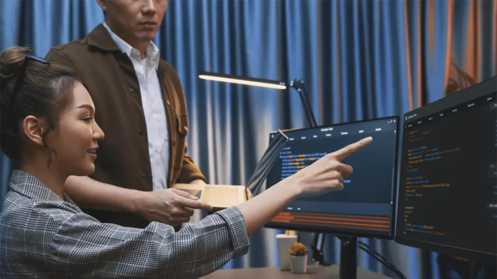 Two developers discussing code.